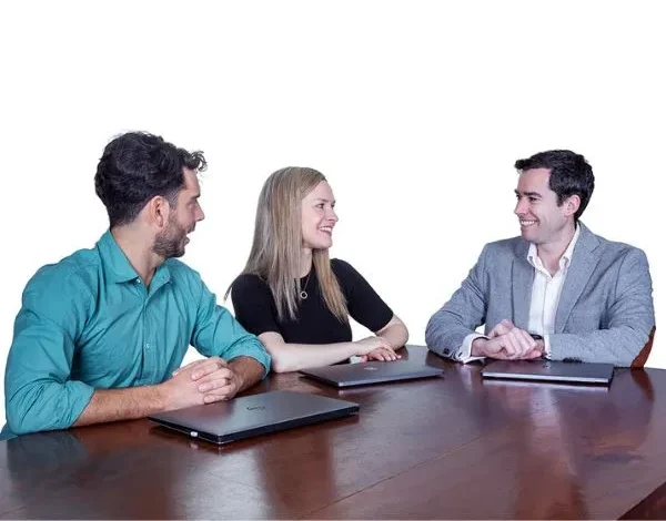 eWebsites team members, including Tomás, discussing digital marketing and local SEO strategies during a team meeting.